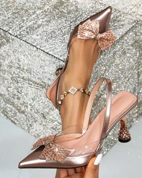 Elena Rhinestone Bow Flared Heels In Rose Gold